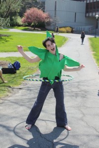 A student volunteer wearing a hemp leaf costume made by another volunteer at Hempstravaganza